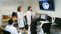 Students looking at a monitor